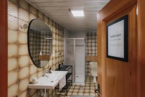 a bathroom with a sink and a mirror at City Bungalow in Schladming
