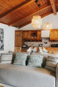 a living room with a couch with pillows on it at City Bungalow in Schladming