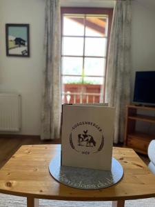a box sitting on top of a wooden table at Guggenbergerhof in Maria Luggau