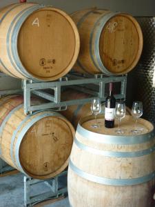 a bunch of wine barrels with wine glasses on them at Weingut Bernhard in Daisendorf