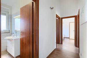 a bathroom with a sink and a mirror at Villa Lara 1 in Ližnjan +18 photos