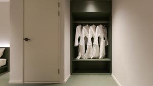 a closet filled with lots of white shoes at Anook Hotel Ulsan Mugeo in Ulsan