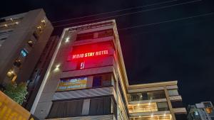 a building with a sign that reads know star hotel at Mojo stay hotel in Ahmedabad