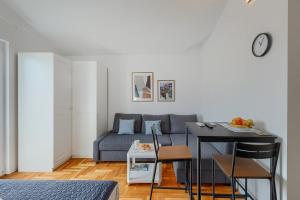 a living room with a couch and a table at Apartment Vallera in Medulin