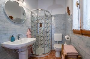 a bathroom with a sink and a shower and a toilet at House Luca in Barban +27 photos