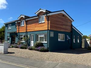 a house with a blue and brown at Ty Boia Bed & Breakfast in St. Davids
