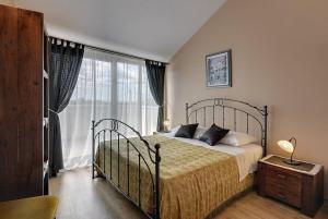 a bedroom with a bed and a large window at Villa Dea in Svetvinčenat +16 photos