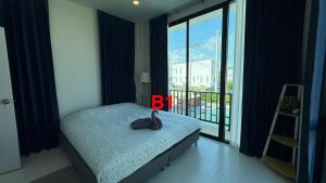 a bedroom with a bed and a large window at Pool Villa Maephim 34, by Somjai in Ban Tha Fat +11 photos