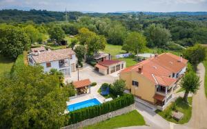 an aerial view of a house with a swimming pool at Villa Semy in Pazin