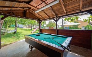 a pool table in a pavilion with a pool table at Villa Semy in Pazin
