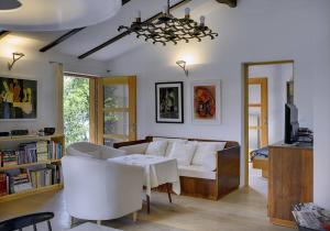 a living room with a couch and a table at Villa Mala Villa in Krnica