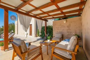 a living room with a couch and chairs and a table at Villa Lasa in Pazin