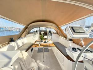 a boat with a table in the middle at Hausboot Segelyacht Nui in Burgtiefe auf Fehmarn 
