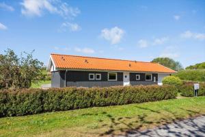 a small house with an orange roof at FY130-Middelfart-Stjernevej-117 in Middelfart