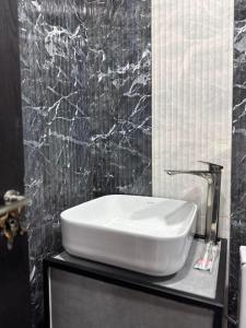 a white sink on a counter in a bathroom at Ararat hotel in Goris