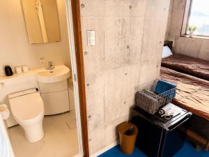 a bathroom with a toilet and a sink at 江田島BASE in Okimi in Etajima
