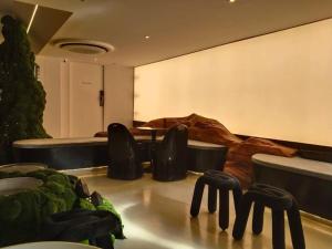 a conference room with black chairs and a table at Big Tree Old Town Hotel in Chiang Mai +34 photos