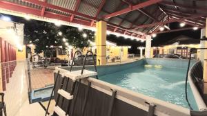 a large swimming pool in a building at Irama Resort Amir YJS , Pantai Irama Bachok in Bachok