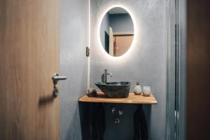 a bathroom with a sink and a mirror at Apartmán NIC VÍC in Loučná nad Desnou +10 photos