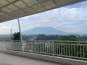 a view of a mountain from a balcony at Hotel Paris Santika in Rawara