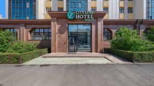 a hotel entrance with a sign that reads culinary hotel at City Line HOTEL in Astana