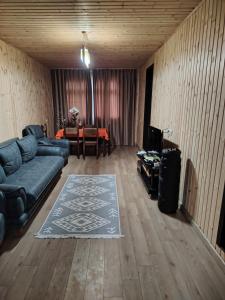 a living room with a couch and a table at Sun ray in Ch'ik'unet'i +31 photos
