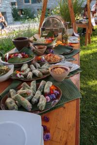 a buffet of food on a table with plates of food at signinahotel in Laax