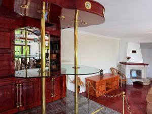 a living room with a glass table and a fireplace at Villa Four-bedroom Prcan Kotor in Prčanj