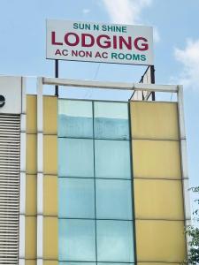 a sign on the side of a building at Sun N Shine in Pune +20 photos