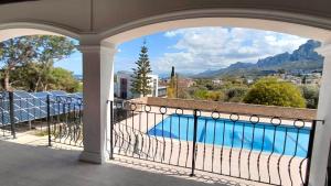 a balcony with a view of a swimming pool at Villa Tiara by HolidayKeys in Kyrenia