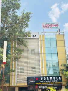 a building with a sign on top of it at Sun N Shine in Pune