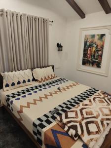 a bedroom with a bed with a blanket on it at The Beach House Marari in Mararikulam +15 photos
