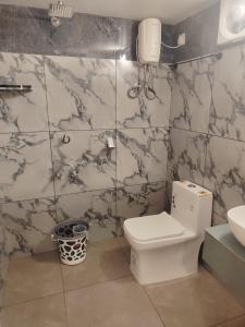 a bathroom with a toilet and a sink at The Beach House Marari in Mararikulam