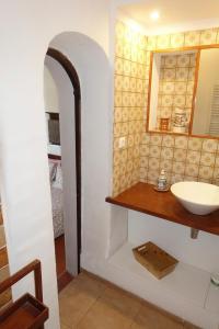 a bathroom with a sink and a mirror at Montes de Baixo in Odeceixe +44 photos