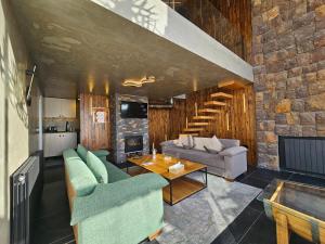 a living room with a couch and a table at O Sommet in Zaarour