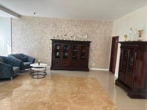 a living room with a couch and a table at Hotel Parc in Craiova