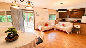 a living room with a couch and a table at Velez Nazari Cortijo Azud in Vélez de Benaudalla