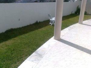 a chair sitting on the side of a patio at Dar chat in Kelibia