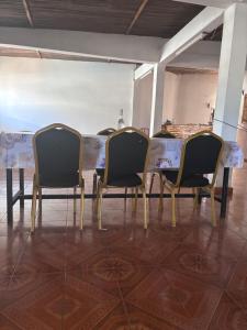a table with four chairs sitting around it at LE Triomphe in Antsiranana