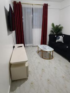 a living room with a couch and a table at BR Homes 2 Bedroom in Bungoma
