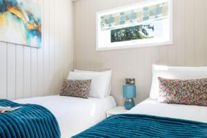 two beds sitting next to each other in a room at Scald Law in Penicuik