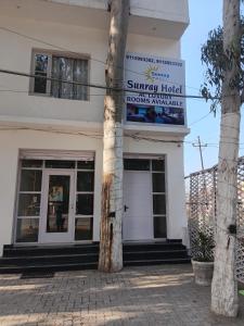 a building with a sign on the front of it at Hotel Sunray in Tarn Tāran