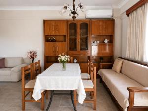 a living room with a table and a couch at Dimitris house in Parga
