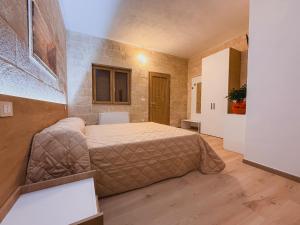 a bedroom with a large bed in a room at Agriturismo Tenuta Santarcangelo in Scanzano +39 photos