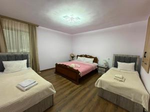 a room with two beds in a room at Narine Bed and Breakfast, Tour in Tatʼev +5 photos