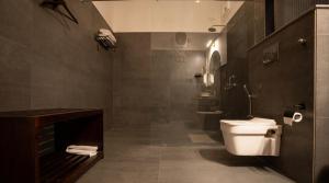 a bathroom with a toilet and a sink at Garrison at Dera Bagseu in Bikaner +34 photos