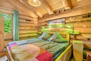 a bedroom with a bed in a log cabin at Ferienhütte 15 in Sankt Englmar