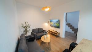 a living room with a couch and a table at Casa Las Conchas in La Rábita