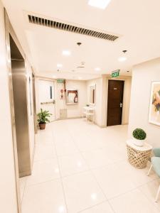 an empty lobby of a hospital with a waiting room at Milton Hotel Makati in Manila