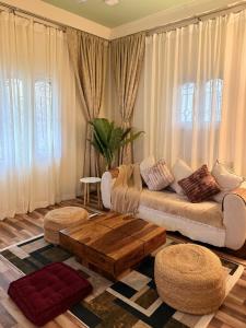 a living room with a couch and a coffee table at Sunshine Stays in Siliguri